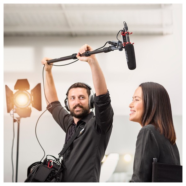 Man holding Rode microphone