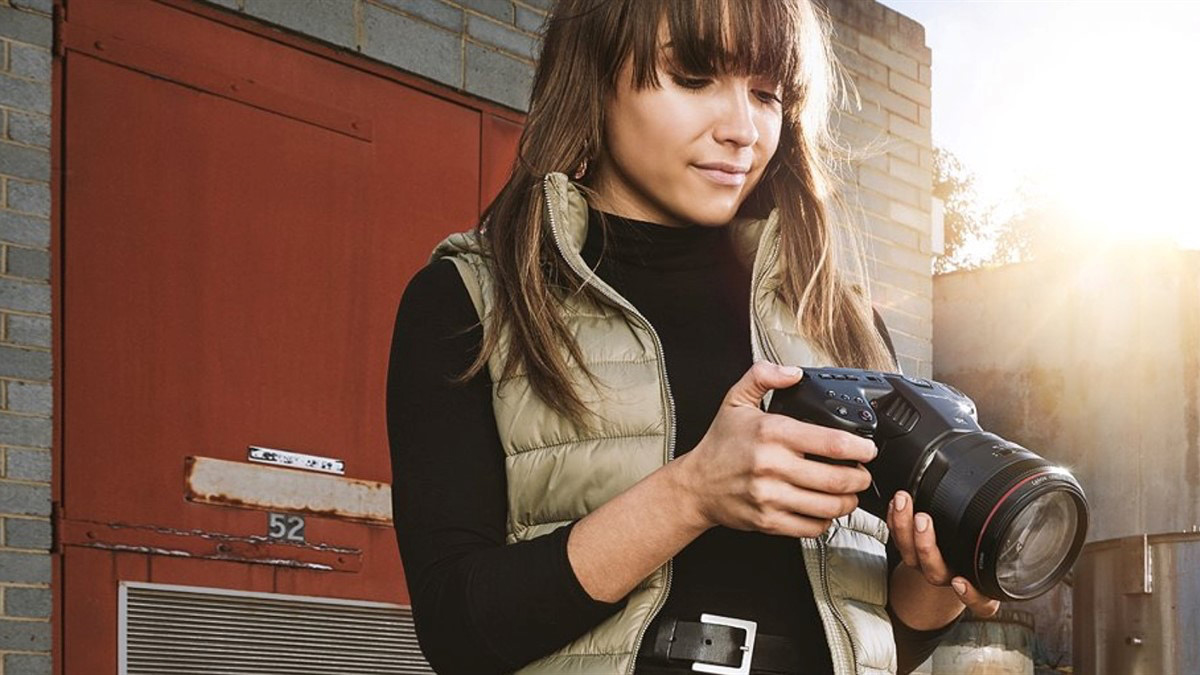 Woman holding Blackmagic 6k Camera